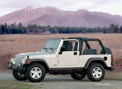 Jeep Unlimited LJ silver against mountain background